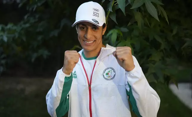 Algerian boxer Imane Khelif poses for a photo after an interview with SNTV at the 2024 Summer Olympics, Sunday, Aug. 4, 2024, in Paris, France. (AP Photo/Vadim Ghirda)