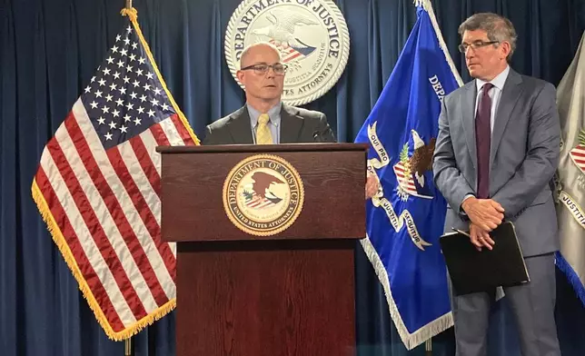 FBI Assistant Special Agent in Charge Stephen Kelleher, left, and Acting United States Attorney for the District of Massachusetts Joshua Levy, right, face reporters during a news conference Wednesday, Aug. 28, 2024, in Boston, held to announce the arrest of former Stoughton Police Detective Matthew Farwell on murder charges. (AP Photo/Steven LeBlanc)