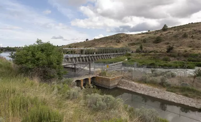 FILE - The Klamath River head gates are seen here on Wednesday, June 9, 2021, in Klamath Falls, Ore. (AP Photo/Nathan Howard, File)