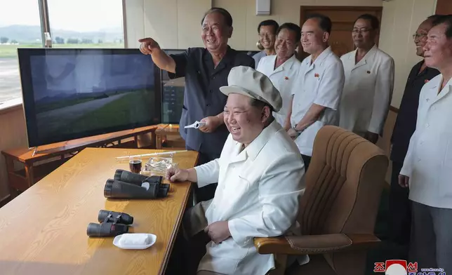 In this photo provided by the North Korean government, its leader Kim Jong Un inspects a demonstration of what it says a drone crashing into a target at an undisclosed location in North Korea, Saturday, Aug. 24, 2024. Independent journalists were not given access to cover the event depicted in this image distributed by the North Korean government. The content of this image is as provided and cannot be independently verified. Korean language watermark on image as provided by source reads: "KCNA" which is the abbreviation for Korean Central News Agency. (Korean Central News Agency/Korea News Service via AP)