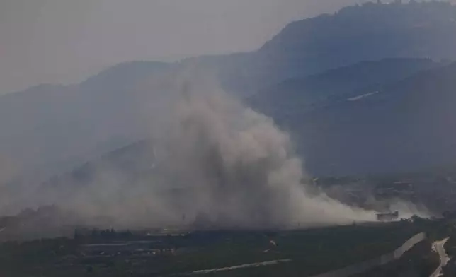 Smoke rises from an Israeli airstrike on Kfar Kila, a Lebanese border village with Israel in south Lebanon, as it seen from Marjayoun town in south Lebanon, Monday, Aug. 26, 2024. (AP Photo/Hussein Malla)