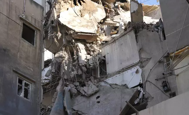 Damaged buildings are seen after being hit by an Israeli airstrike on Tuesday evening in the southern suburbs of Beirut, Lebanon, Wednesday, July 31, 2024. (AP Photo/Hussein Marla)