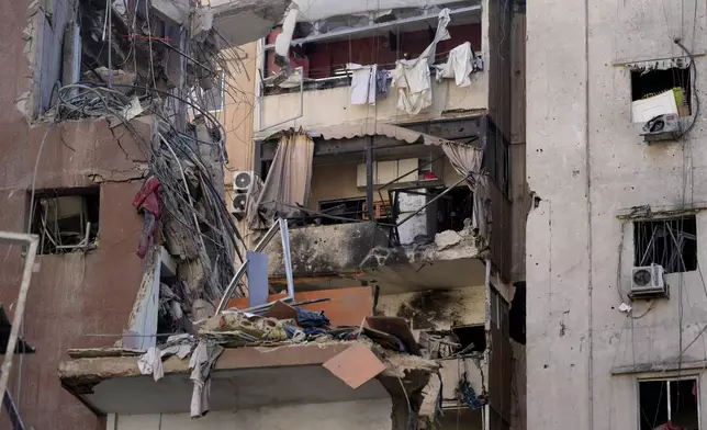 Buildings are damaged after being hit by an Israeli airstrike on Tuesday evening in the southern suburbs of Beirut, Lebanon, Wednesday, July 31, 2024. (AP Photo/Hussein Malla)