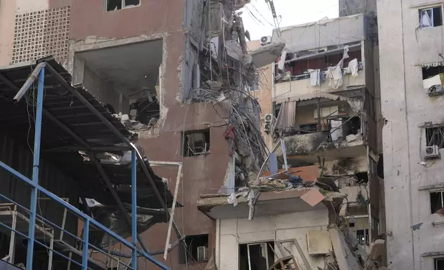 Buildings are damaged after being hit by an Israeli airstrike on Tuesday evening in the southern suburbs of Beirut, Lebanon, Wednesday, July 31, 2024. Israel on Tuesday carried out a rare strike on Beirut, which it said killed a top Hezbollah commander who was allegedly behind a weekend rocket attack that killed 12 young people in the Israeli-controlled Golan Heights. (AP Photo/Hussein Malla)