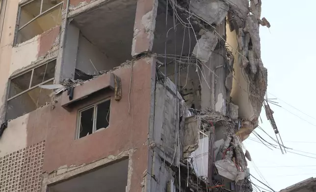 A damaged building is seen after being hit by an Israeli airstrike on Tuesday evening in a southern suburb of Beirut, Lebanon, Wednesday, July 31, 2024. (AP Photo/Hussein Marla)