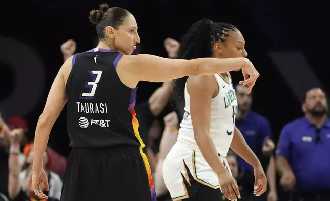 Phoenix Mercury guard Diana Taurasi (3) celebrates after her 3-point basket against the New York Liberty during the first half of a WNBA basketball game Monday, Aug. 26, 2024, in Phoenix. (AP Photo/Ross D. Franklin)