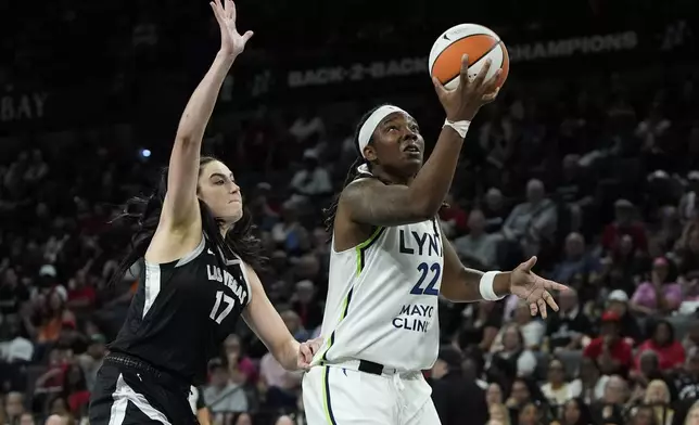 Minnesota Lynx Myisha Hines-Allen shoots around Las Vegas Aces center Megan Gustafson (17) during the second half of a WNBA basketball game Wednesday, Aug. 21, 2024, in Las Vegas. (AP Photo/John Locher)