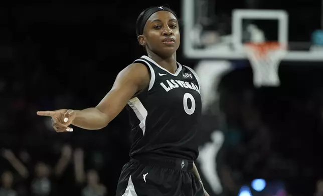 Las Vegas Aces guard Kelsey Plum (10) reacts after scoring against the Minnesota Lynx during the first half of a WNBA basketball game Wednesday, Aug. 21, 2024, in Las Vegas. (AP Photo/John Locher)