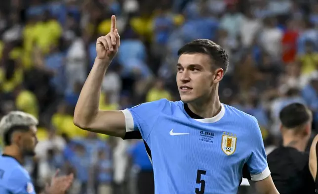 FILE - Uruguay's Manuel Ugarte celebrates after defeating Brazil in a penalty shootout during a Copa America quarterfinal soccer match in Las Vegas, July 6, 2024.(AP Photo/David Becker, File)