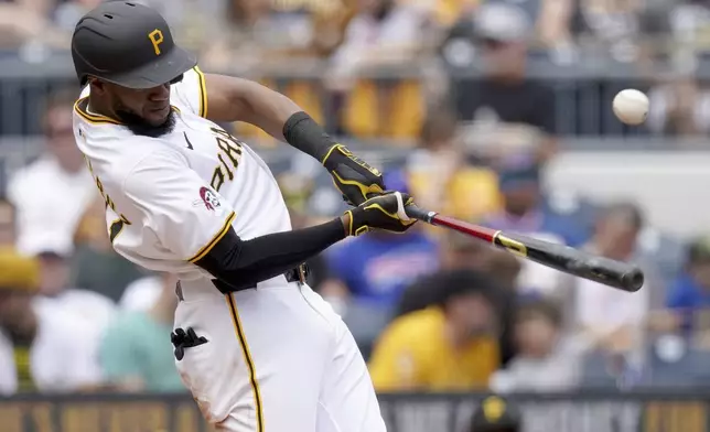 Pittsburgh Pirates' Bryan De La Cruz hits a single during the sixth inning of a baseball game against the Seattle Mariners, Saturday, Aug. 17, 2024, in Pittsburgh. (AP Photo/Matt Freed)