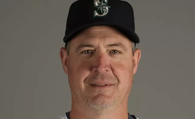 FILE - Dan Wilson of the Seattle Mariners baseball team, posed Feb. 23, 2023, in Peoria, Ariz. (AP Photo/Charlie Riedel, File)