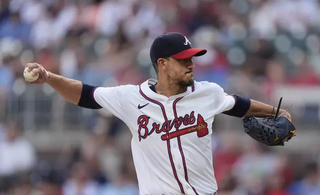 Atlanta Braves pitcher Charlie Morton (50) works against the Miami Marlins in the first inning of a baseball game, Thursday, Aug. 1, 2024, in Atlanta. (AP Photo/John Bazemore)