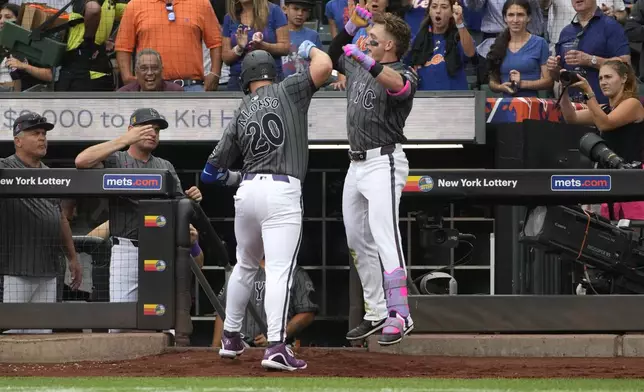 New York Mets' Pete Alonso, left, and Harrison Bader, right, celebrate after Alonso hit a home run during the second inning of a baseball game against the Miami Marlins, Saturday, Aug. 17, 2024, in New York. (AP Photo/Pamela Smith)