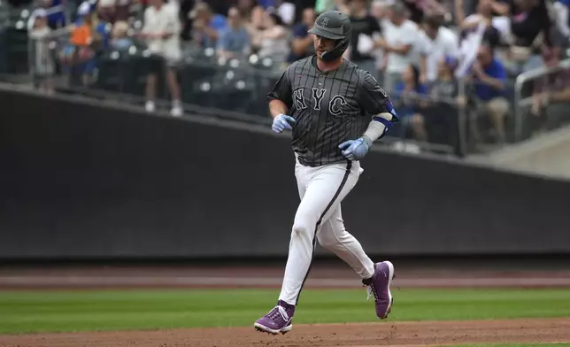 New York Mets' Pete Alonso runs to second base after hitting a home run during the second inning of a baseball game against the Miami Marlins, Saturday, Aug. 17, 2024, in New York. (AP Photo/Pamela Smith)