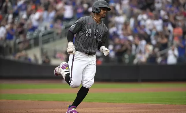 New York Mets' Francisco Lindor runs to home plate after hitting a home run during the first inning of a baseball game against the Miami Marlins, Saturday, Aug. 17, 2024, in New York. (AP Photo/Pamela Smith)