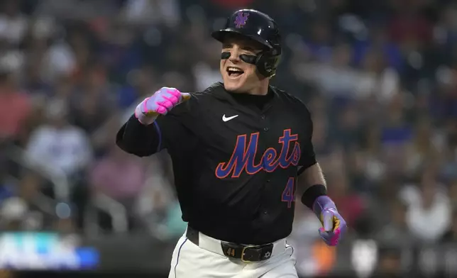 New York Mets' Harrison Bader reacts after getting walked by Miami Marlins pitcher Roddery Muñoz during the second inning of a baseball game, Friday, Aug. 16, 2024, in New York. (AP Photo/Pamela Smith)