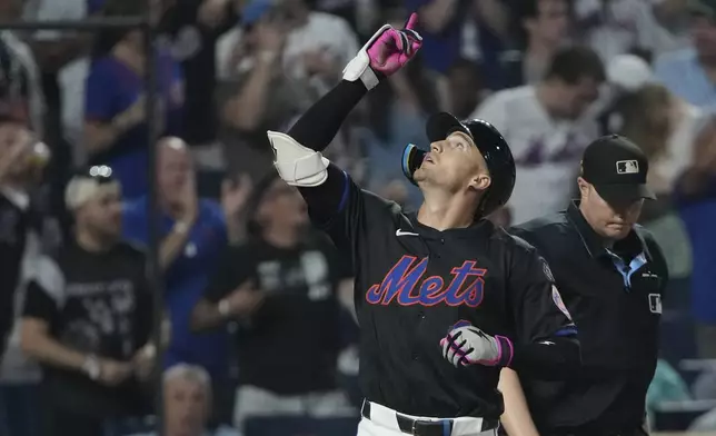 New York Mets' Brandon Nimmo celebrates after hitting a three-run home run leading to Francisco Lindor and Mark Vientos scoring during the fourth inning of a baseball game against the Miami Marlins, Friday, Aug. 16, 2024, in New York. (AP Photo/Pamela Smith)