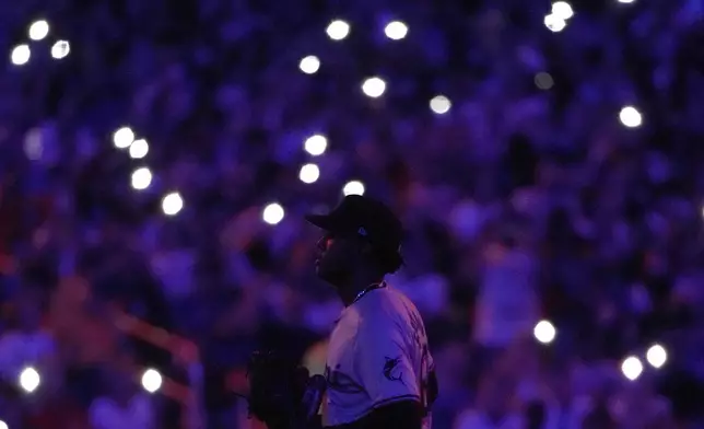 Miami Marlins' George Soriano runs to the pitcher's mound to replace Roddery Muñoz during the fourth inning of a baseball game against the New York Mets, Friday, Aug. 16, 2024, in New York. (AP Photo/Pamela Smith)