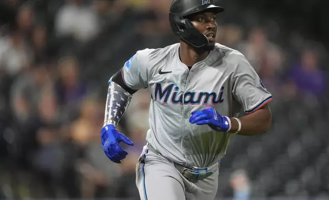 Miami Marlins' Jesus Sanchez heads up the first-base line after hitting a three-run home run off Colorado Rockies relief pitcher Angel Chivilli in the ninth inning of after a baseball game, Tuesday, Aug. 27, 2024, in Denver. (AP Photo/David Zalubowski)