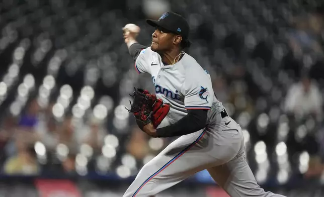 Miami Marlins relief pitcher George Soriano works against the Colorado Rockies in the eighth inning of a baseball game Wednesday, Aug. 28, 2024, in Denver. (AP Photo/David Zalubowski)