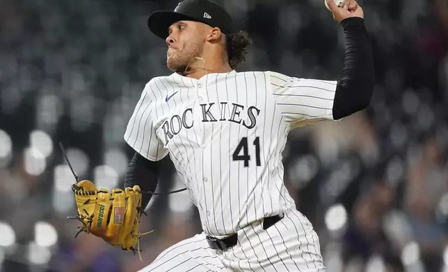 Colorado Rockies relief pitcher Luis Peralta works against the Miami Marlins in the eighth inning of a baseball game Tuesday, Aug. 27, 2024, in Denver. (AP Photo/David Zalubowski)