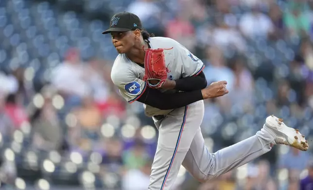 Miami Marlins starting pitcher Edward Cabrera works against the Colorado Rockies in the first inning of a baseball game Monday, Aug. 26, 2024, in Denver. (AP Photo/David Zalubowski)