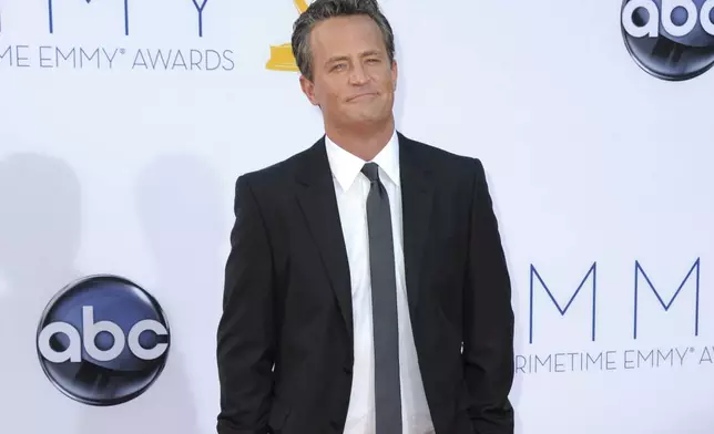 FILE - Actor Matthew Perry arrives at the 64th Primetime Emmy Awards in Los Angeles on Sept. 23, 2012. (Photo by Jordan Strauss/Invision/AP, File)
