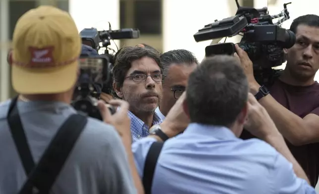 Dr. Mark Chavez, a physician from San Diego, charged in connection with actor Matthew Perry's death from an accidental ketamine overdose, is surrounded by members of the media as he arrives at the Roybal Federal Courthouse in Los Angeles, Friday, Aug. 30, 2024. (AP Photo/Damian Dovarganes)