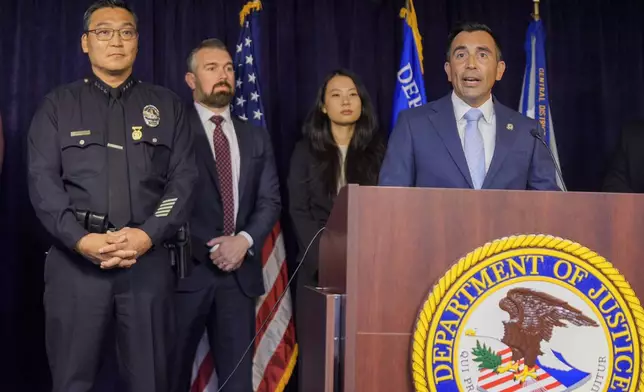 United States Attorney Martin Estrada, at podium, is joined by Los Angeles Police Chief Dominic Choi, far left, and other officials to announce court filings related to the death of actor Matthew Perry in Los Angeles on Thursday, Aug. 15, 2024. (AP Photo/Damian Dovarganes)