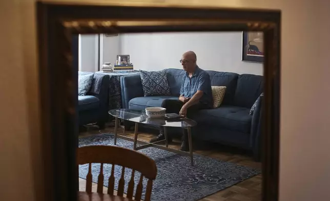 Ron Spitzer, stroke survivor, rests at home on Monday, July 15, 2024, in New York. In the 1980s and ’90s, h played bass and drums in rock bands, but a stroke in 2009 put Spitzer in a wheelchair, his voice a whisper. (AP Photo/Andres Kudacki)