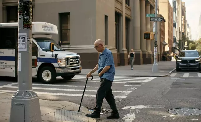 Ron Spitzer, a stroke survivor, walks to his music therapy session on Monday, July 15, 2024, in New York. (AP Photo/Andres Kudacki)