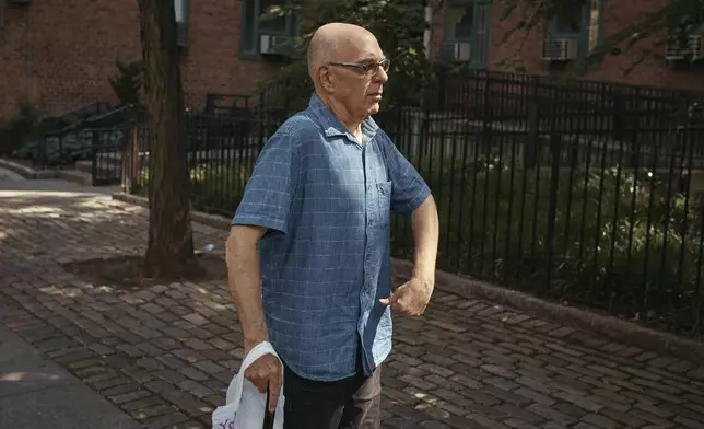 Ron Spitzer, stroke survivor, walks back home on Monday, July 15, 2024, in New York. (AP Photo/Andres Kudacki)