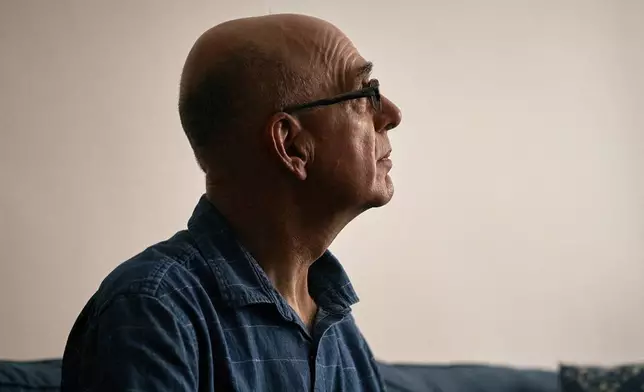 Ron Spitzer, stroke survivor, looks at the window as he rests at home, on Monday, July 15, 2024, in New York. (AP Photo/Andres Kudacki)