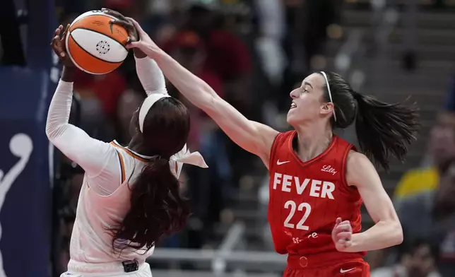 Phoenix Mercury's Kahleah Copper (2) is fouled by Indiana Fever's Caitlin Clark (22) during the second half of a WNBA basketball game, Friday, Aug. 16, 2024, in Indianapolis. (AP Photo/Darron Cummings)