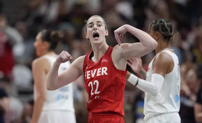 Indiana Fever guard Caitlin Clark reacts during the first half of a WNBA basketball game against the Phoenix Mercury, Friday, Aug. 16, 2024, in Indianapolis. (AP Photo/Darron Cummings)