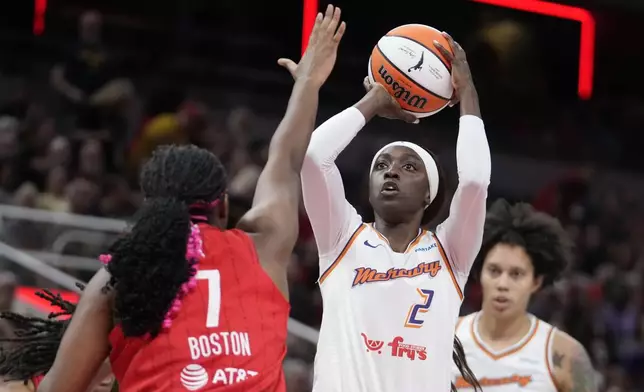 Phoenix Mercury's Kahleah Copper (2) shoots over Indiana Fever forward Aliyah Boston (7) during the first half of a WNBA basketball game, Friday, Aug. 16, 2024, in Indianapolis. (AP Photo/Darron Cummings)