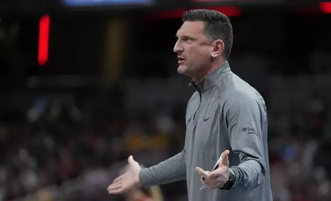 Phoenix Mercury head coach Nate Tibbetts argues a call during the first half of a WNBA basketball game against the Indiana Fever, Friday, Aug. 16, 2024, in Indianapolis. (AP Photo/Darron Cummings)