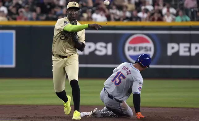 Arizona Diamondbacks shortstop Geraldo Perdomo gets the force out on New York Mets' Tyrone Taylor (15) on a ball hit by Jeff McNeil in the second inning during a baseball game, Tuesday, Aug 27, 2024, in Phoenix. (AP Photo/Rick Scuteri)