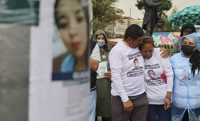 Husband and wife Marcos Vazquez and Benita Ornelas, from the search collective "Uniendo Esperanzas" or Uniting Hope, attend an Anglican Mass on the fifth anniversary of the disappearance of their son Fernando Ivan Ornelas in Mexico City, Sunday, July 21, 2024. (AP Photo/Ginnette Riquelme)