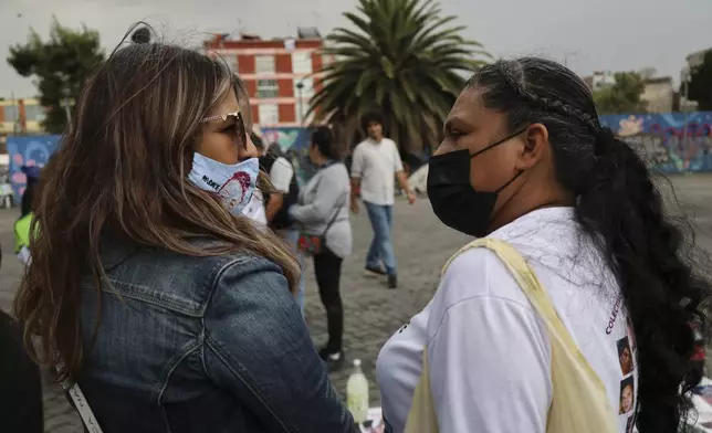 Veronica Rosas, left, and Dionicia Pelcastre, who both have missing sons, Diego and Guillermo, visit before attending an Anglican Mass with members of their search collective "Uniendo Esperanzas" or Uniting Hope, in Mexico City, Sunday, July 21, 2024. (AP Photo/Ginnette Riquelme)