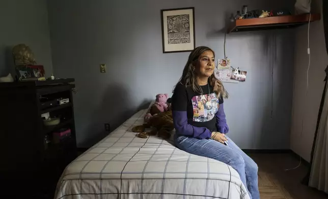 Veronica Rosas poses for a portrait in the bedroom of her missing son Diego Maximiliano in Ecatepec, Mexico, Friday, Aug. 2, 2024. Rosas' son went missing when he was 16 years old on Sept. 4, 2015. (AP Photo/Ginnette Riquelme)