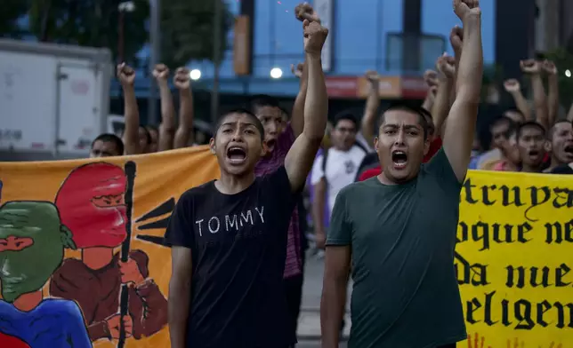 Classmates of the 43 Ayotzinapa students who went missing almost 10 years ago march to demand justice for their loved ones in Mexico City, Monday, Aug. 26, 2024. (AP Photo/Felix Marquez)