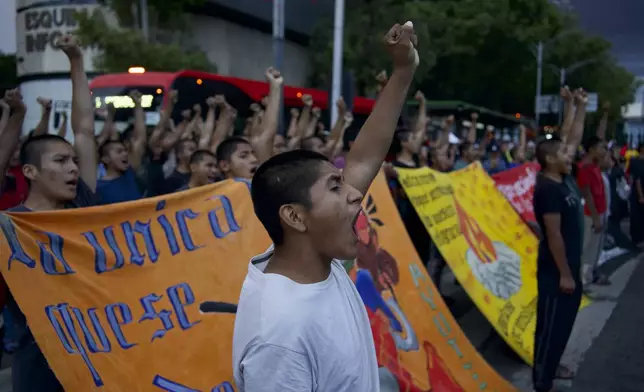 Classmates of the 43 Ayotzinapa students who went missing almost 10 years ago march to demand justice for their loved ones in Mexico City, Monday, Aug. 26, 2024. (AP Photo/Felix Marquez)