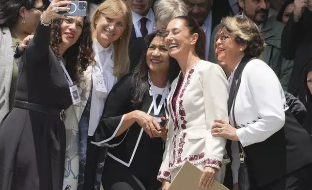 Mexican President-elect Claudia Sheinbaum poses for a photo after her certification as the winner of the presidential election during a ceremony at the Federal Electoral Tribunal in Mexico City, Thursday, Aug. 15, 2024. (AP Photo/Fernando Llano)