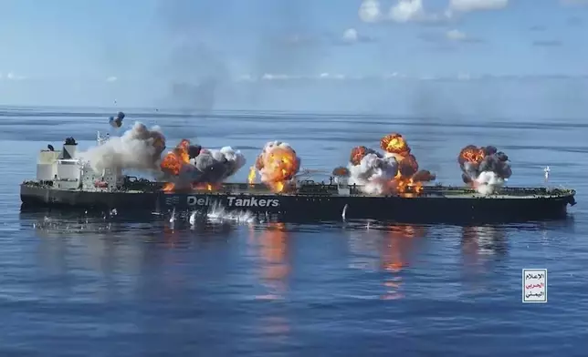 This frame grab from video released by the Ansar Allah Media Office, the media arm of Yemen's Houthi rebels, on Thursday, Aug. 29, 2024, shows explosions striking the Greek-flagged oil tanker Sounion in the Red Sea after Yemen's Houthi rebels boarded and set explosives on the tanker, which was earlier abandoned after the Houthis repeatedly attacked it, setting off blasts that put the Red Sea at risk of a major oil spill. The logo in the bottom righthand corner of the image reads in Arabic: "Yemeni War Media." (Ansar Allah Media Office via AP)