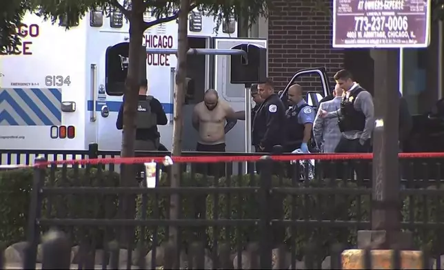 Joshua Zimmerman, who escaped from a Mississippi courthouse and is wanted on murder and armed robbery charges, is taken into custody following a standoff with police at a restaurant in Chicago on Wednesday, Aug. 21, 2024. (ABC 7 Chicago via AP)