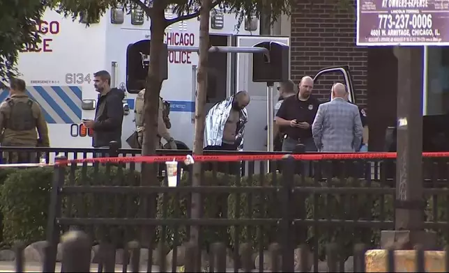 Joshua Zimmerman, who escaped from a Mississippi courthouse and is wanted on murder and armed robbery charges, is taken into custody following a standoff with police at a restaurant in Chicago on Wednesday, Aug. 21, 2024. (ABC 7 Chicago via AP)