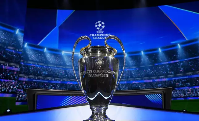 The trophy is displayed in the hall ahead of the Champions League, league phase, draw, in Monaco, Thursday, Aug. 29, 2024. (AP Photo/Gregorio Borgia)