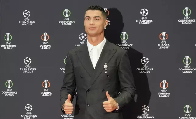 Cristiano Ronaldo, the all-time leading goalscorer in the Champions League, poses as he arrives for the Champions League, league phase, draw, in Monaco, Thursday, Aug. 29, 2024. (AP Photo/Gregorio Borgia)