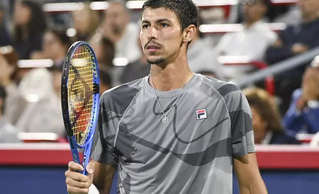 Alexei Popyrin, of Australia, reacts following a shot to Andrey Rublev, of Russia, during the final of the National Bank Open men's tennis tournament in Montreal, Monday, Aug. 12, 2024. (Graham Hughes/The Canadian Press via AP)